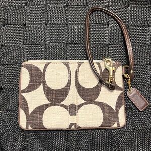 Coach wristlet. Brown and white canvas.